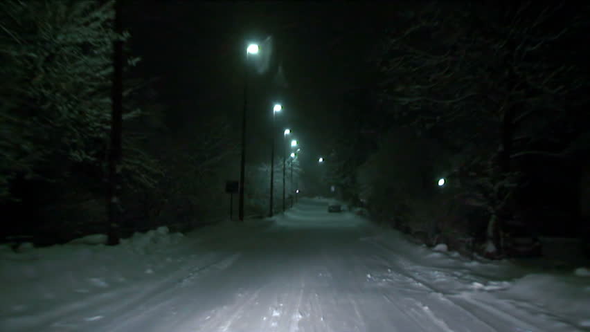 Driving at night during a heavy snowfall