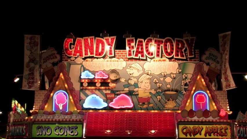 Carnival at night. Candy and food booth brightly lite at night during a carnival.