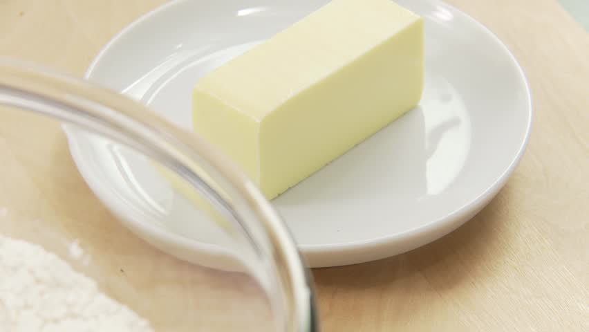 A piece of butter being chopped