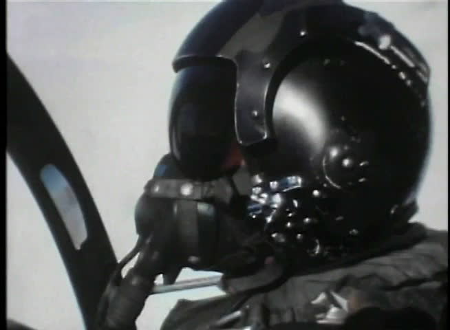 Close-up of pilot sitting in cockpit of fighter jet
