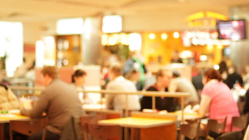 Shopping mall food court with people eating