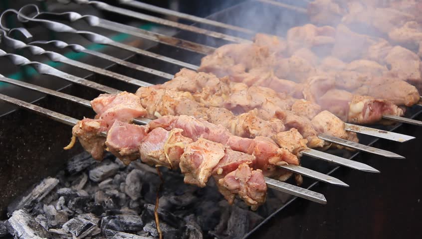 Shish kebab cooking on an outdoor grill