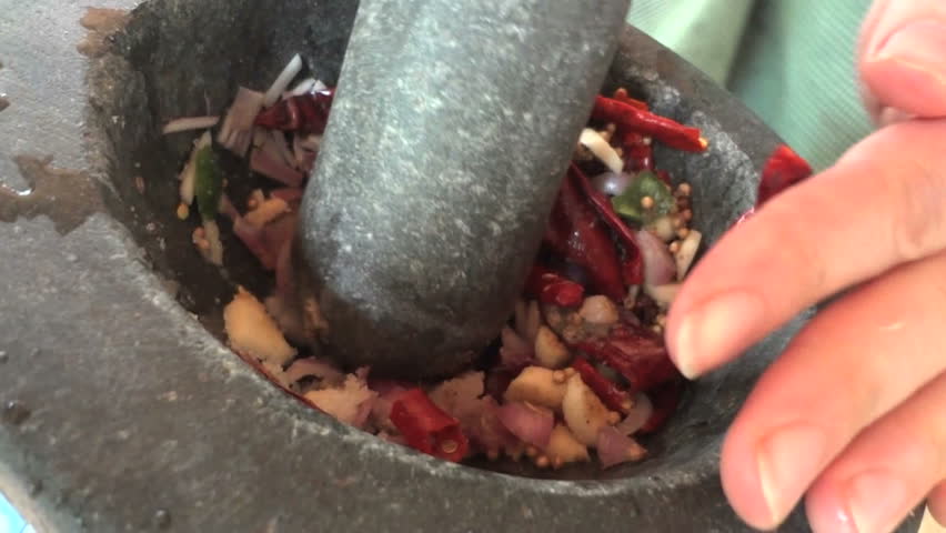 Making fresh curry paste in a mortar