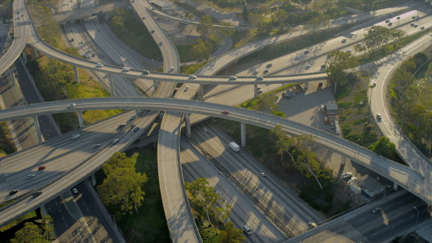 Aerial view of traffic on elevated freeway at intersection city suburbs, USA