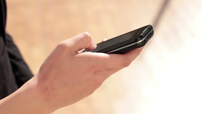 Hands holding smart phone - Young woman with smart phone