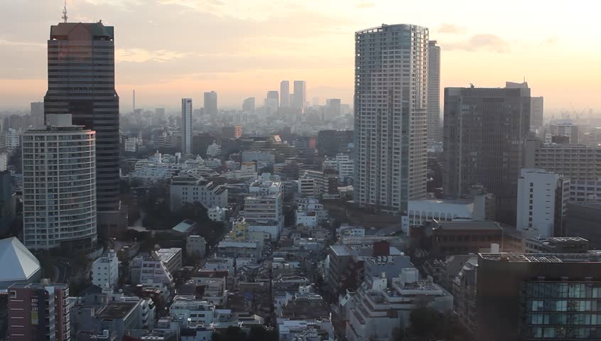 High-rise office buildings and residential apartments in downtown Tokyo, Japan during sunset