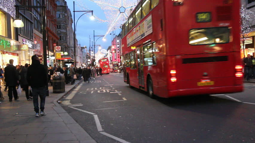 LONDON, UK - DECEMBER 27: Busses and other traffic drive beneath Christmas lights on Oxford Street on December 27, 2011 in London, UK. Oxford Street is one of the main shopping streets of London.