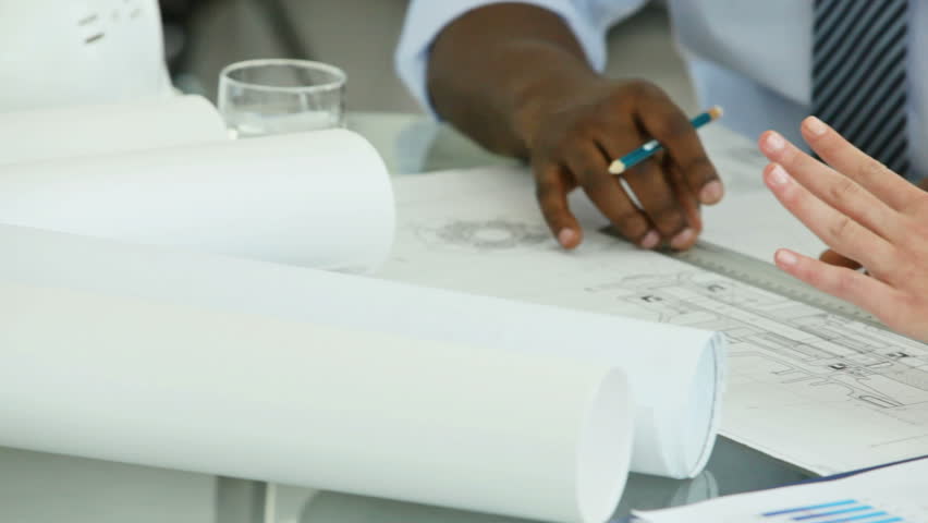 Engineers correcting a blueprint