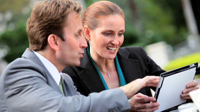 Executive business people meeting informally outdoors