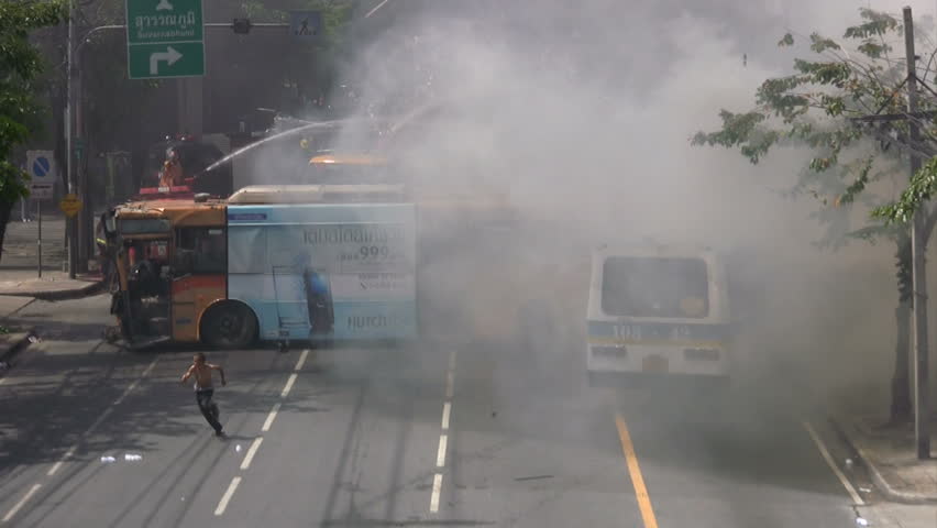 BANGKOK, THAILAND - APRIL 5, 2009: Protesters set buses on fire in violent confrontations with government forces April 5, 2009 in Bangkok, Thailand