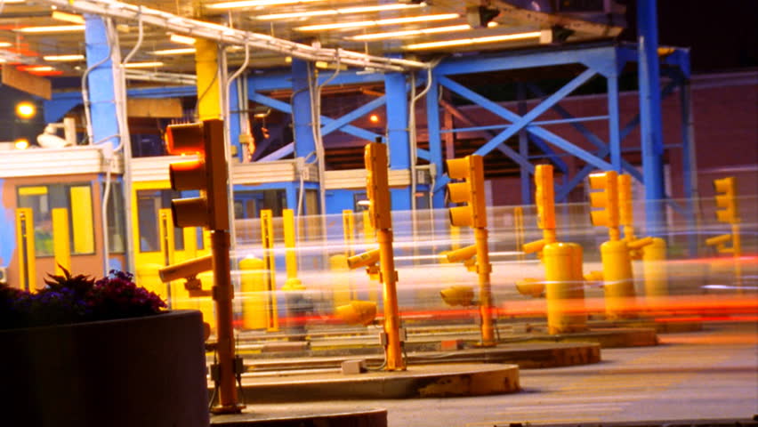 Speeding vehicle blur at toll booth