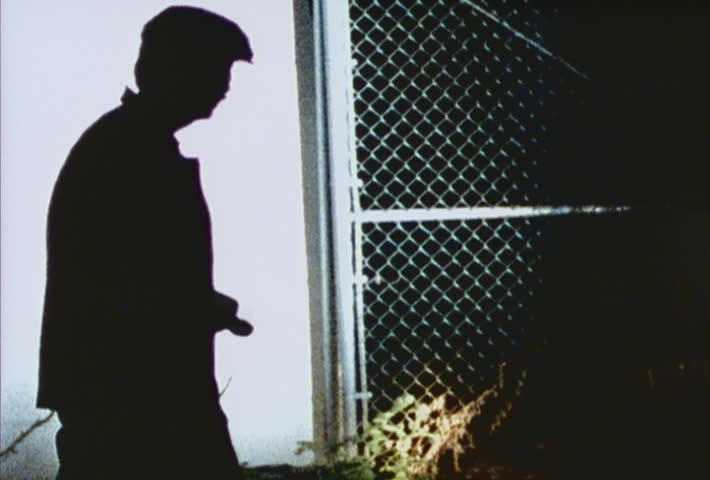 Officer shining flashlight