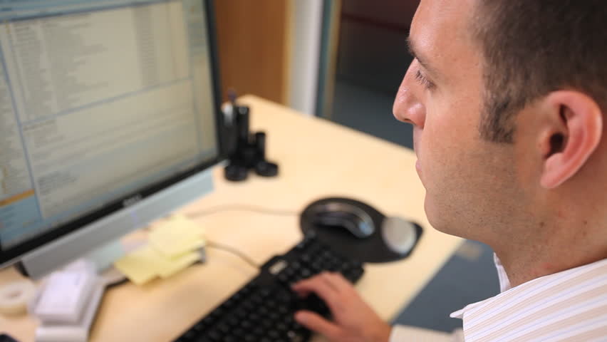Male working on computer in office