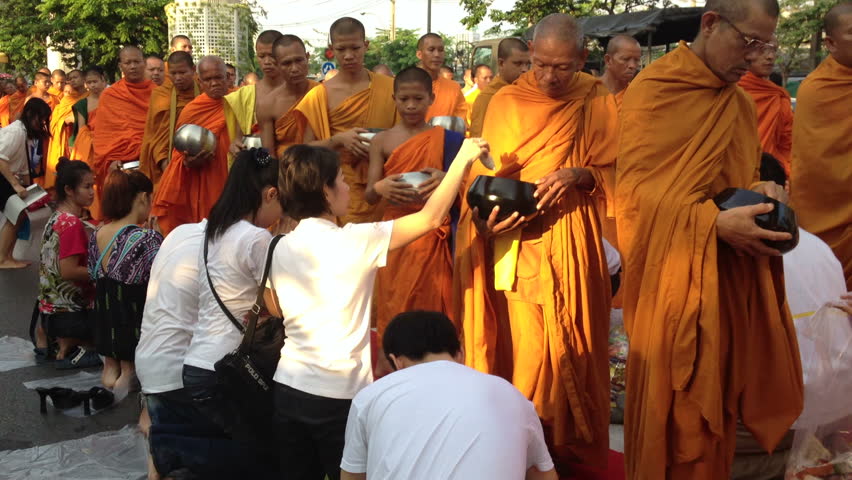 BANGKOK, MARCH 17, 2012: Monks are participating in a Mass Alms Giving of 12,600 monks for the Makha Bucha celebrations in Bangkok, Thailand  on March 17, 2012. 
