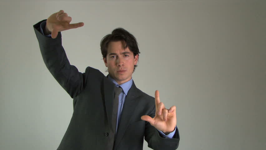 Business male moving virtual graphs, static shot, medium wide shot