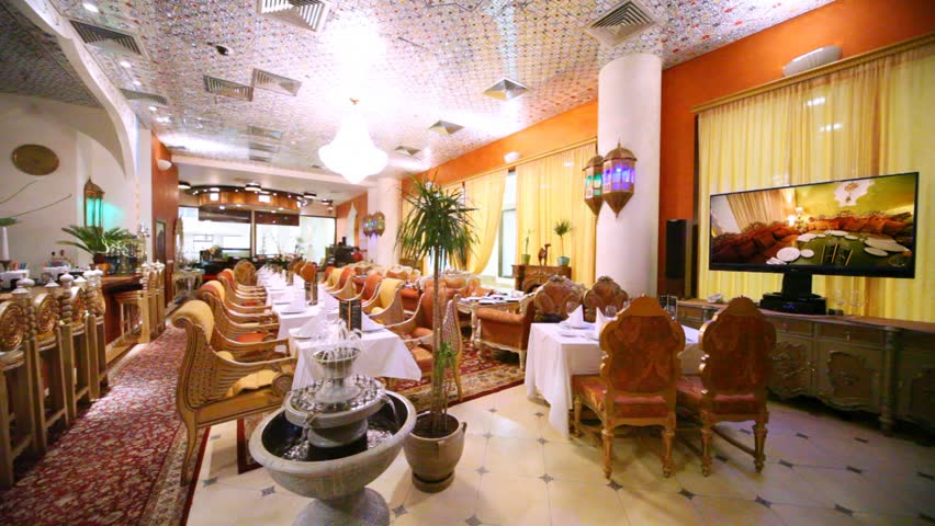 In magnificent lounge of restaurant there is TV and fountain