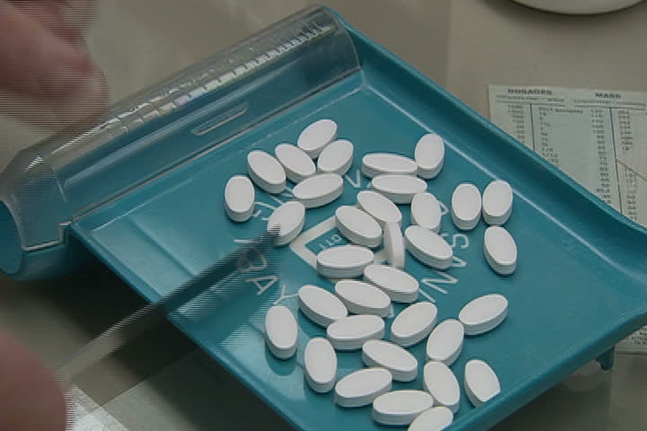 A pharmacist sorting pills.