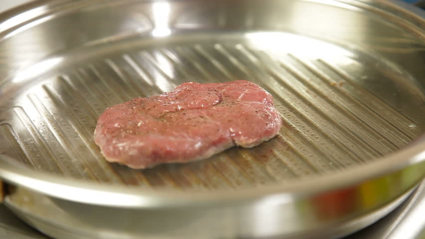 Raw Steak Grilled On Skillet