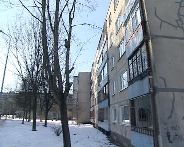 old residential blocks of flats houses renovation. filled special material house wall cracks. pan view.