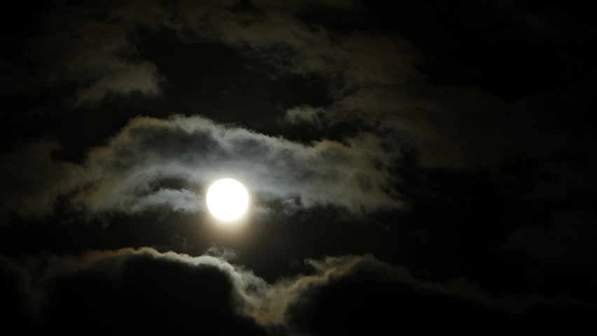 Time lapse of clouds passing full moon