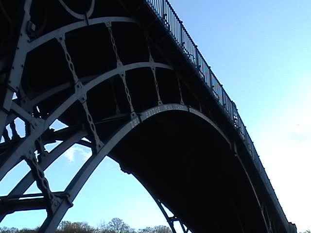 The Iron Bridge crosses the River Severn at the Ironbridge Gorge, by the village of Ironbridge, in Shropshire, England. It was the first bridge in the world to be made out of cast iron