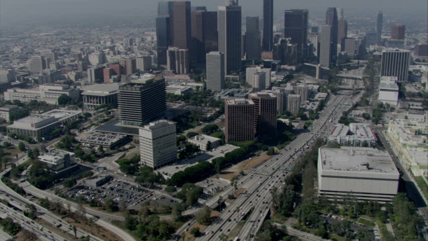 aerial daytime shot of Los Angeles with major freeway and traffic circa 2009