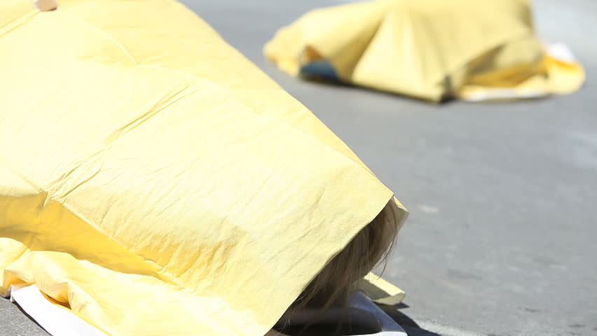victims killed in crash covered on the roadway 