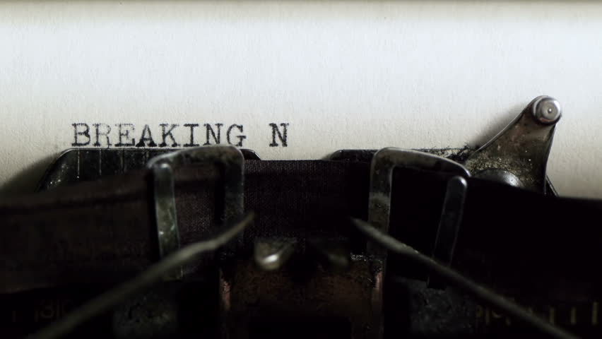 Typing Breaking News (HD). Breaking News being typed and centered on Vintage 1940s typewriter. Ambient audio Included.