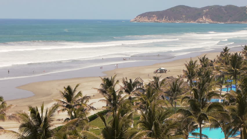 Multitude of waves hit the Mexican Pacific coastline near Acapulco bay Mexico. This is the view of the beach of Acapulco Diamante which is the new developed part of the region.