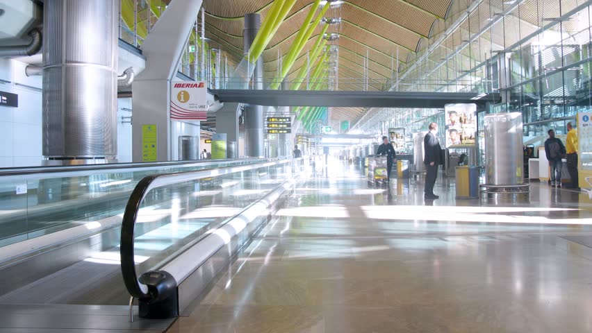 MADRID - MAR 12: (Timelapse View) Employees of airport and passengers go on Barahas airport territory, on Mar 12, 2012 in Madrid, Spain