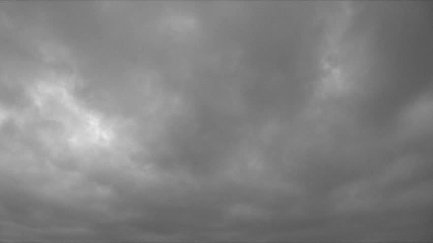 Tracking time lapse of storm clouds and lightning over Pacific Ocean.