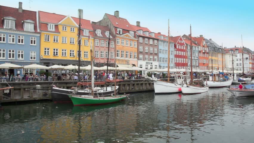 Ship traffic at Nyhavn canal on July 12, 2011 in Copenhagen, Denmark. Nyhavn is 17th century waterfront, canal and entertainment district in Copenhagen, Denmark