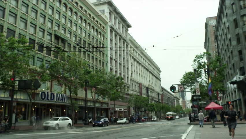 SAN FRANCISCO - CIRCA 2000: Market Street busses passes Historic Trolley circa 2000 in San Francisco, California.