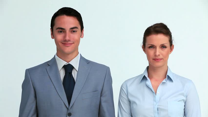 Business people hiding their face with a sign in studio