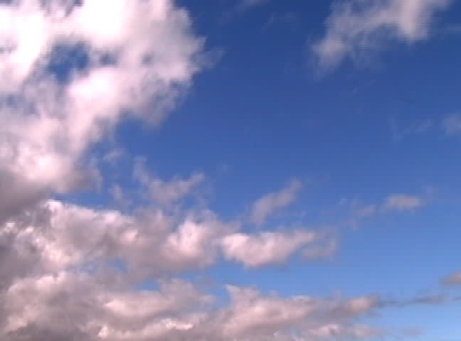 A time lapse done of moving clouds on a clear sunny day.
