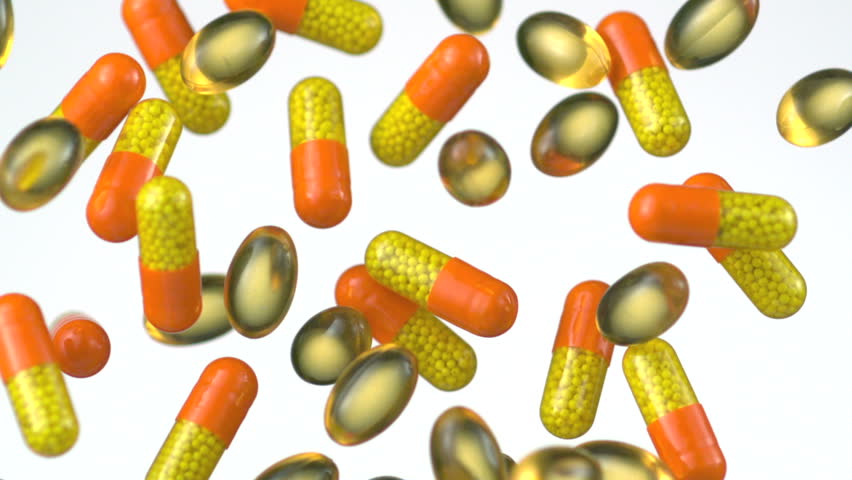 capsule medicine and vitamin falling in the air shooting with high speed camera, phantom flex.