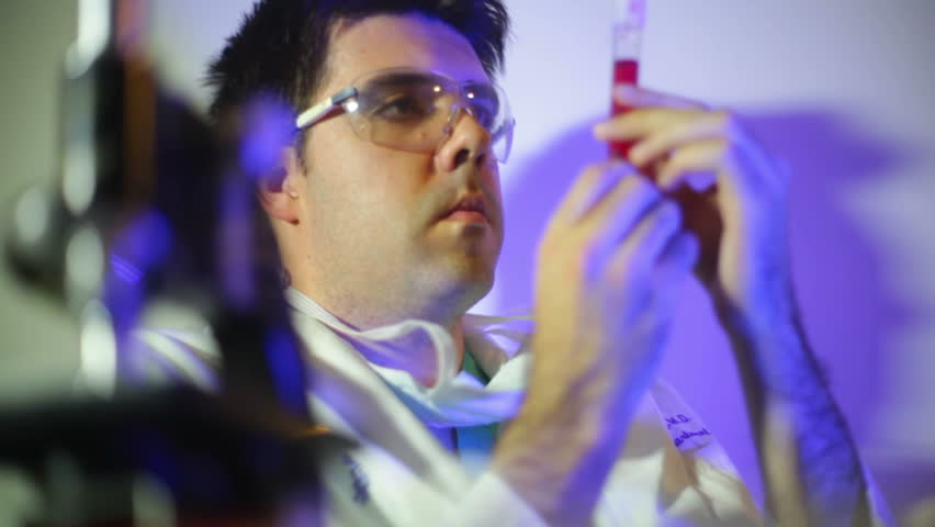 Scientist looking at a blood test