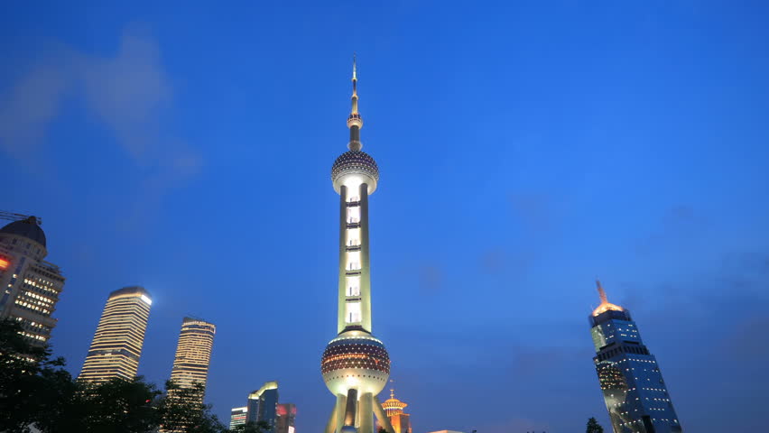 SHANGHAI, CHINA - CIRCA  2012: The Oriental Pearl Tower in Shanghai, China circa 2012. The tower is one of the top ten Shanghai Attractions.