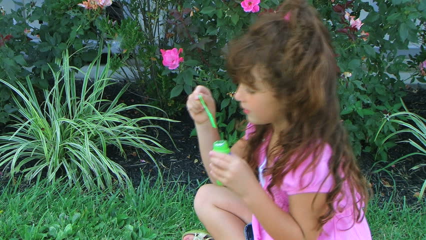 Girl Blowing Bubbles 