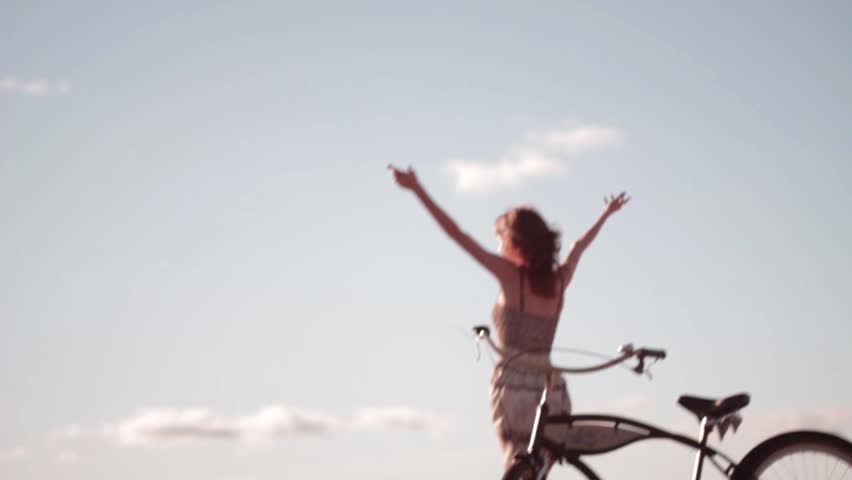 Flying around girl with bike