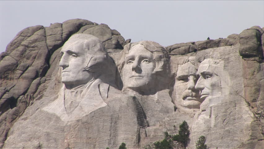 Zoom out of Mount Rushmore National Memorial as seen from the side in South Dakota United States