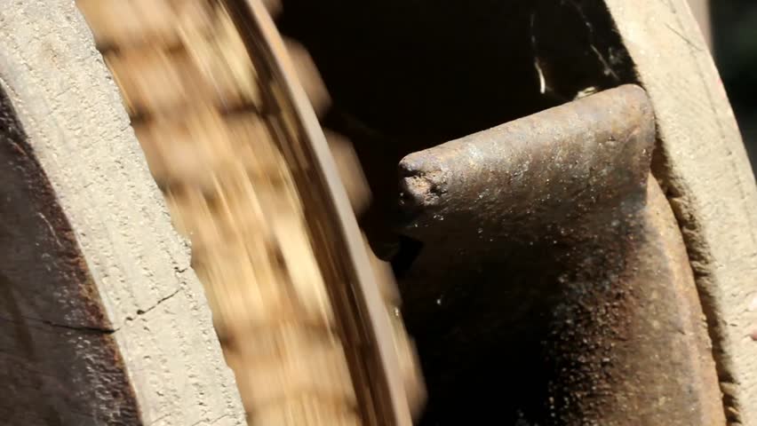 Spinning Noisy Rusty Cast Iron Antique Corn Grinder Wheel Shaking While Running