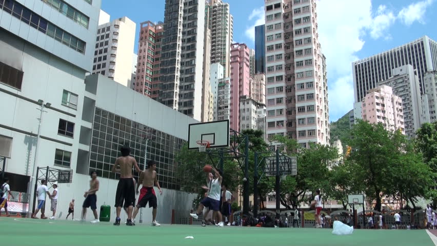 HONG KONG - JULY 28: People are playing basketball on July 28, 2010 in downtown Hong Kong, China
