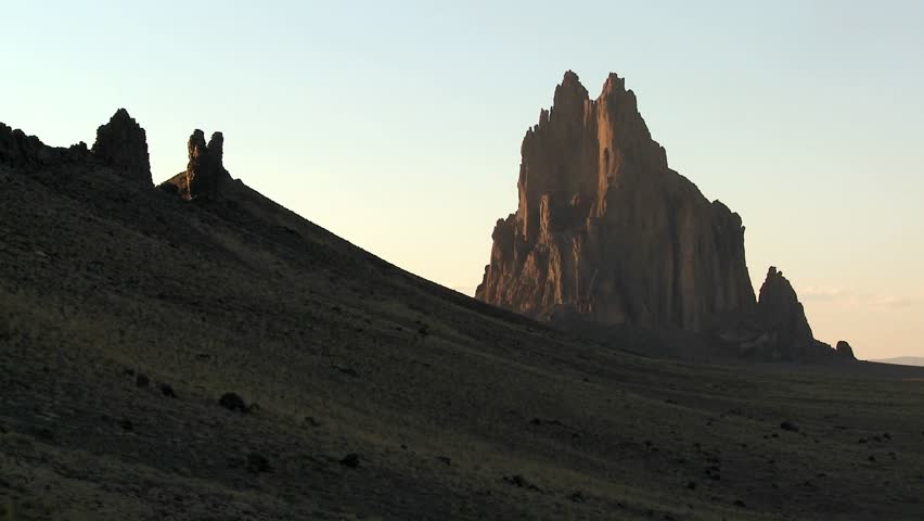 Geologic formations in the desert at sunset