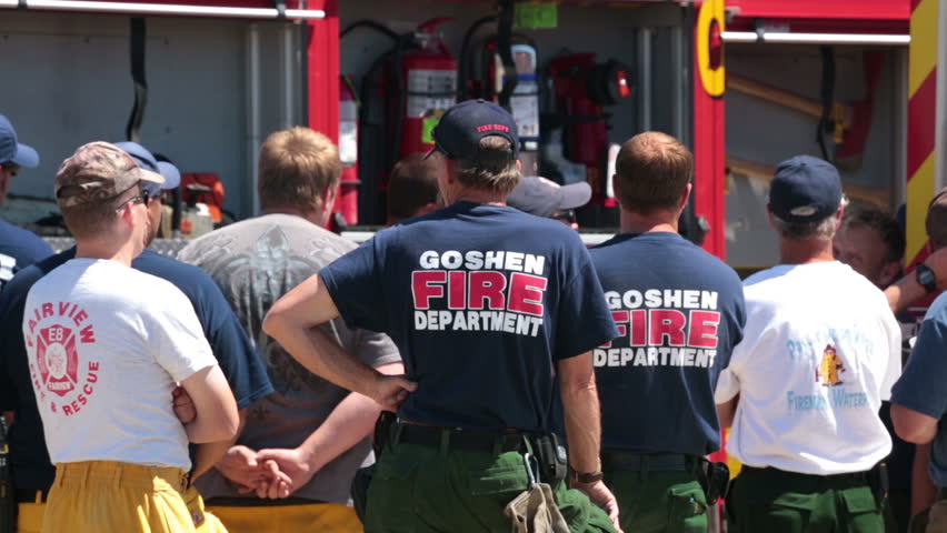 MORONI, SANPETE, UTAH 25 JUN 2012: Fire fighter firemen brief for wildfire work. Wood Hollow central Utah. FEMA Federal Government assistance. Instruction and map descriptions. Heroes and volunteers.