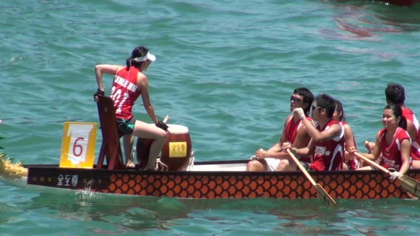 HONG KONG - 26 JULY 2010: People have just taken part in a dragon boat contest in the centre of Hong Kong