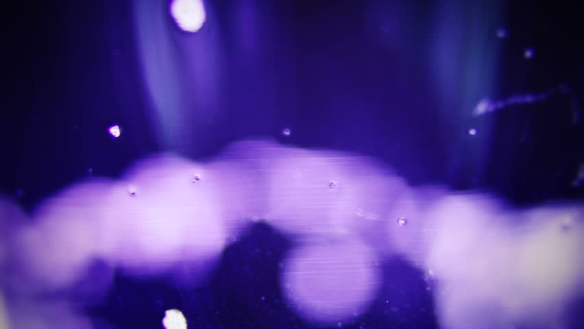 Macro clip of liquid, bubbles and froth. Abstract video that could be used as effect, transition or background and even as a conceptual video.
