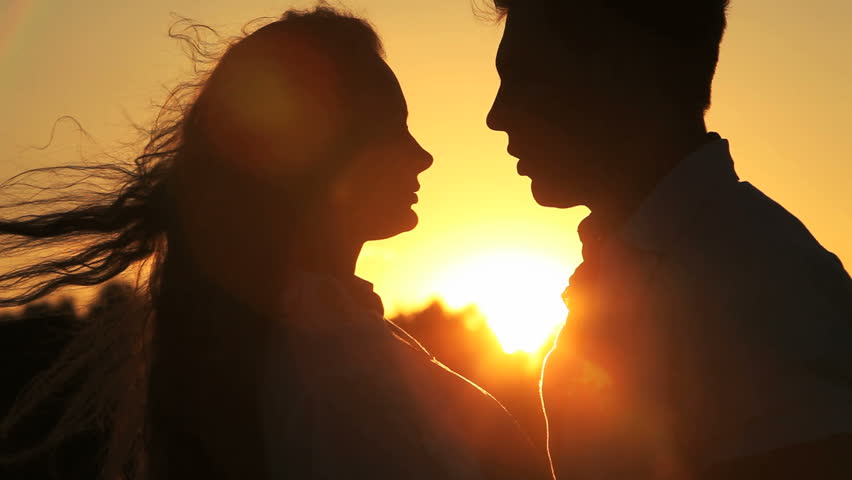 Close-up of a charming couple, man speaking the words of love to his lovely sweetheart