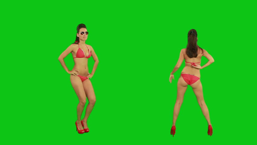 Beautiful young girl dancing against green screen
