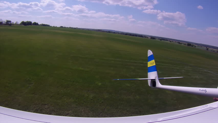 Flying over the Countryside, Bird's-eye, look back. Extreme camera is mounted on the wing RC glider